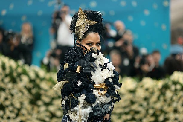 Nicki Minaj at the 2025 Met Gala: A Dandy Pinstripe Vision by Thom Browne