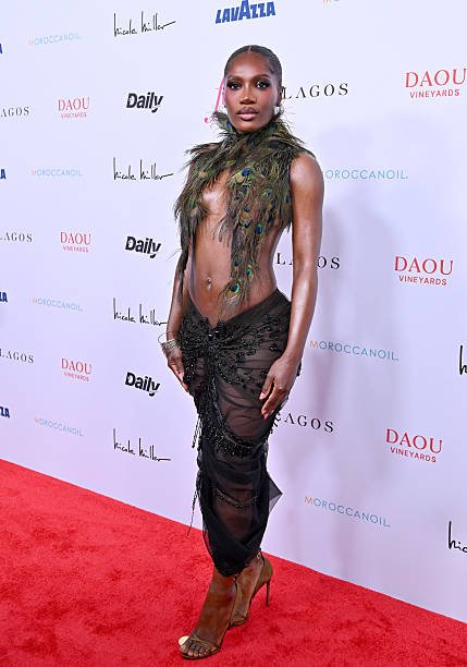 Doechii's Bold Peacock-Feathered Outfit at Fashion Awards 5