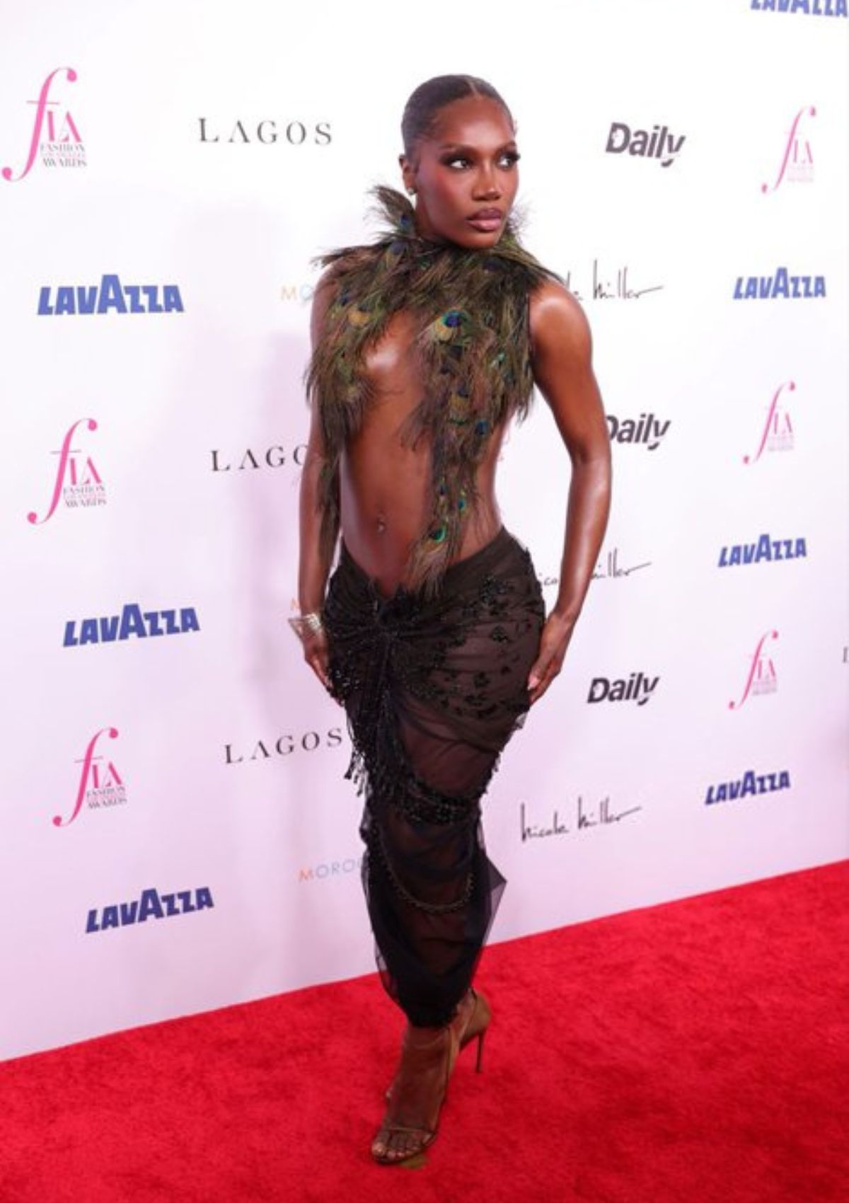 Doechii’s Bold Peacock-Feathered Outfit at Fashion Awards