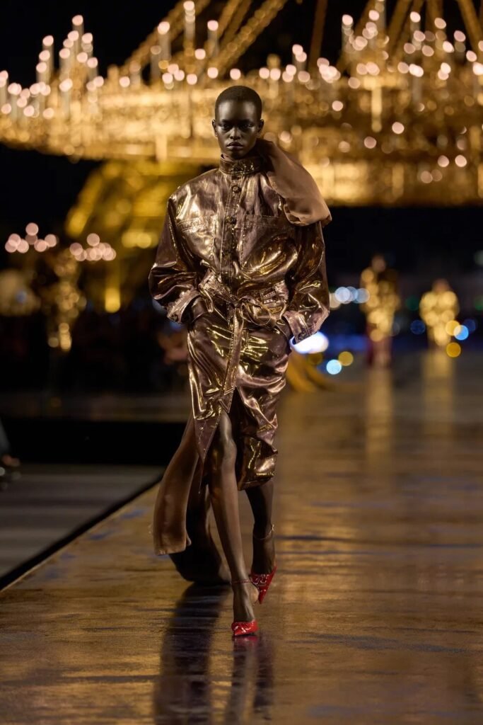 Saint Laurent Spring 2027 by Anthony Vaccarello turns Paris gold with glamorous tailoring, liquid dresses, safari references and a decade of Saint Laurent style.