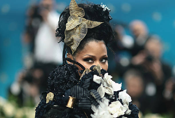 Nicki Minaj IGNITES the 2025 Met Gala in Thom Browne’s Dandy Pinstripe Vision