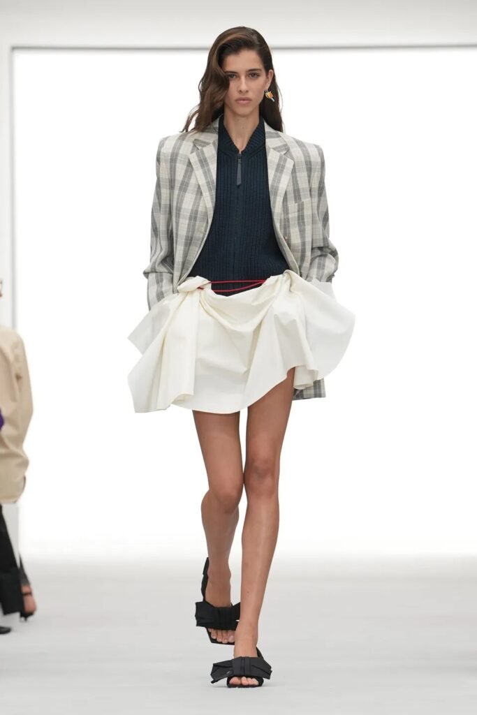 LOEWE 1 LOEWE Spring 2027 Ready-to-Wear by Jack McCollough and Lazaro Hernandez, featuring bold colors, floral prints, micro dresses and sheer layers.