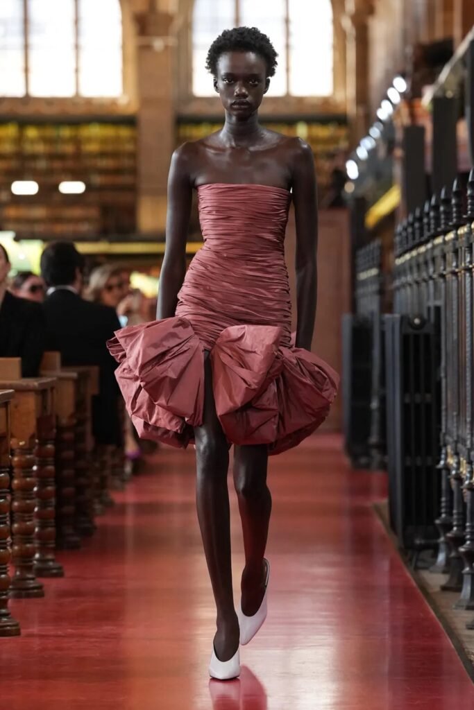 Valentino Spring 2027 Ready-to-Wear by Alessandro Michele, featuring maximalism, vivid colours, corsets, lace, feathers, bows and bold jewellery.