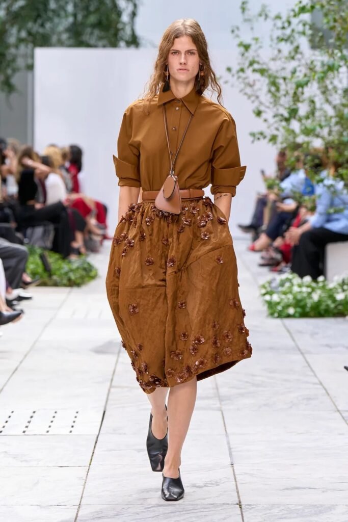 Michael Kors 38 Michael Kors brought a sophisticated dose of modern glamour to New York Fashion Week with his Spring 2027 Ready-to-Wear collection, unveiling a lineup that balanced clean American sportswear with bold artistic references.